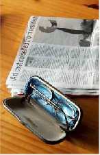 Glasses and newspaper